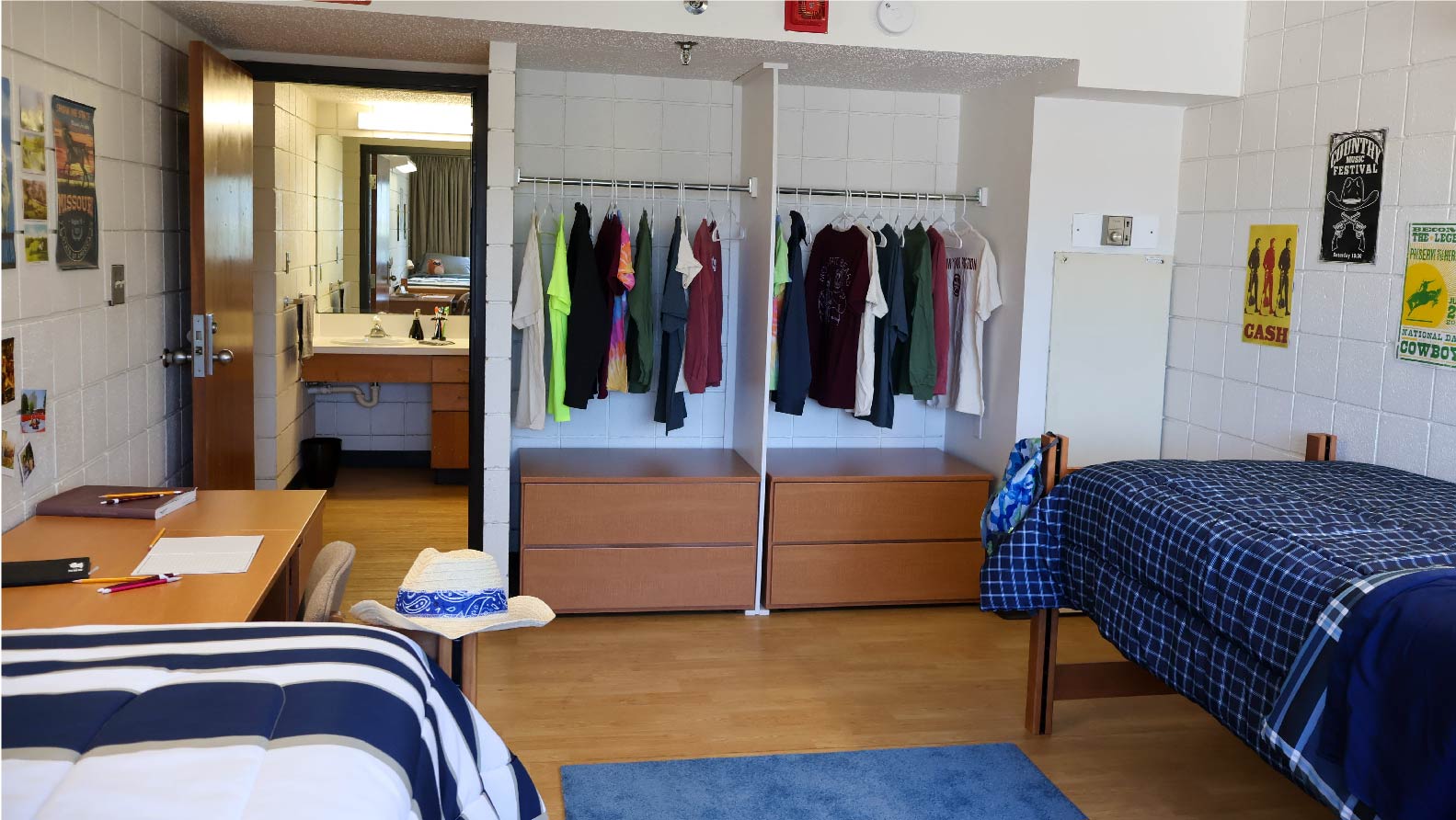 Bedroom with 2 closet spaces each with 2 drawers of storage and hanging bar