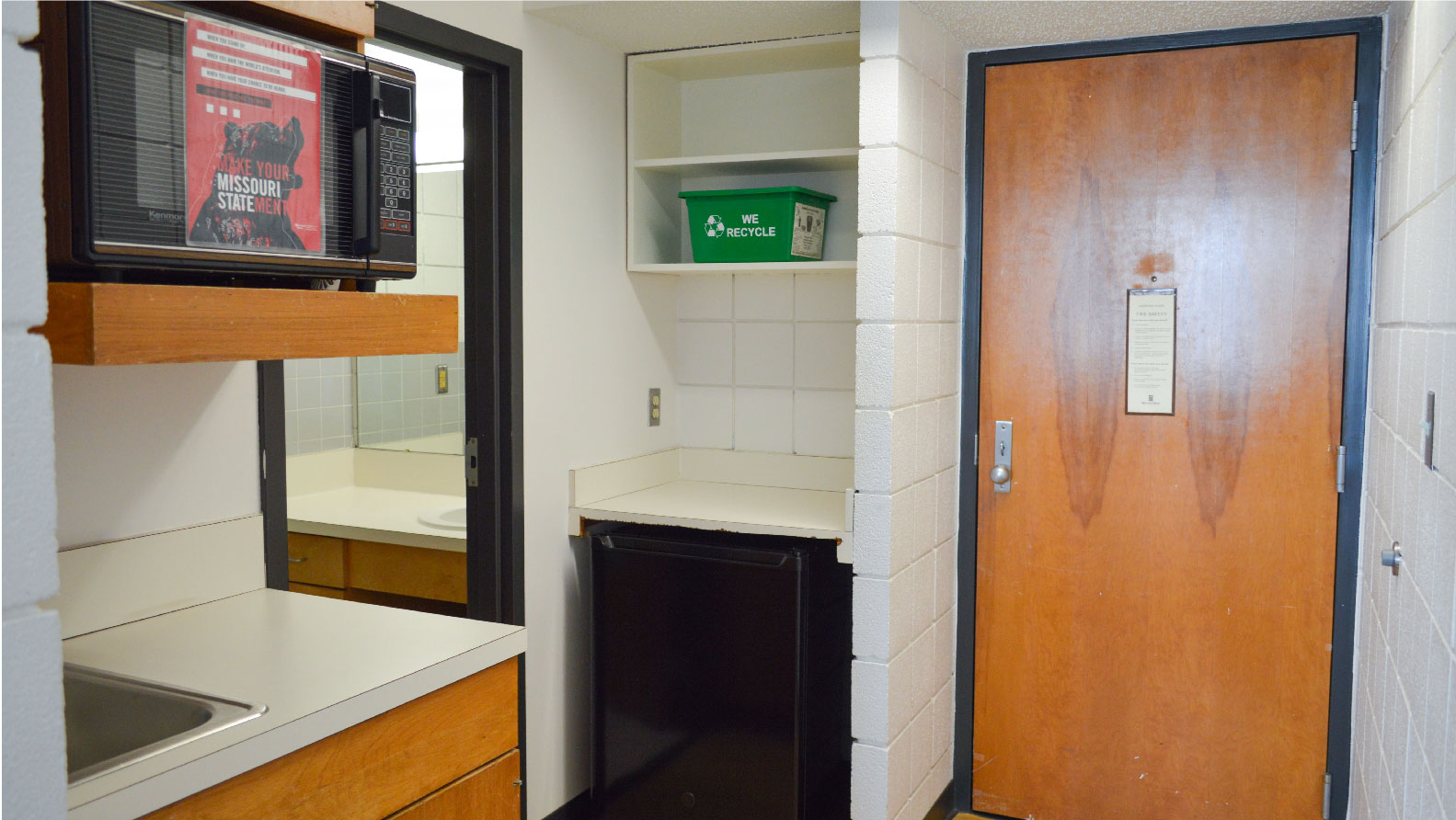 2-person En-suite Kitchenette with sink microwave mini fridge and cabinets next to bathroom