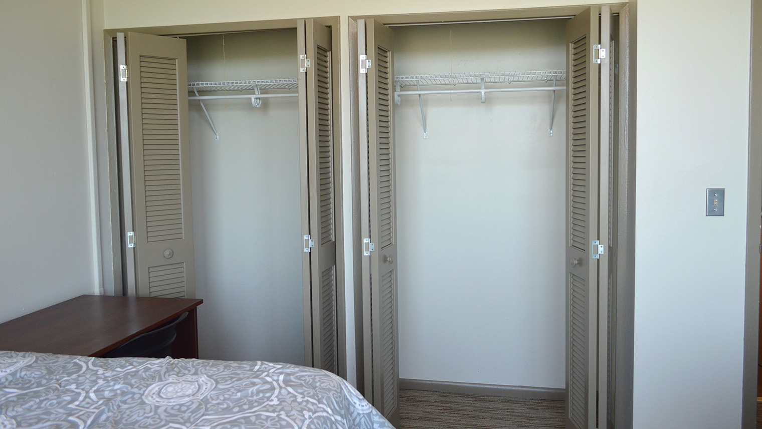 closets with hangin space and top storage with shutter doors