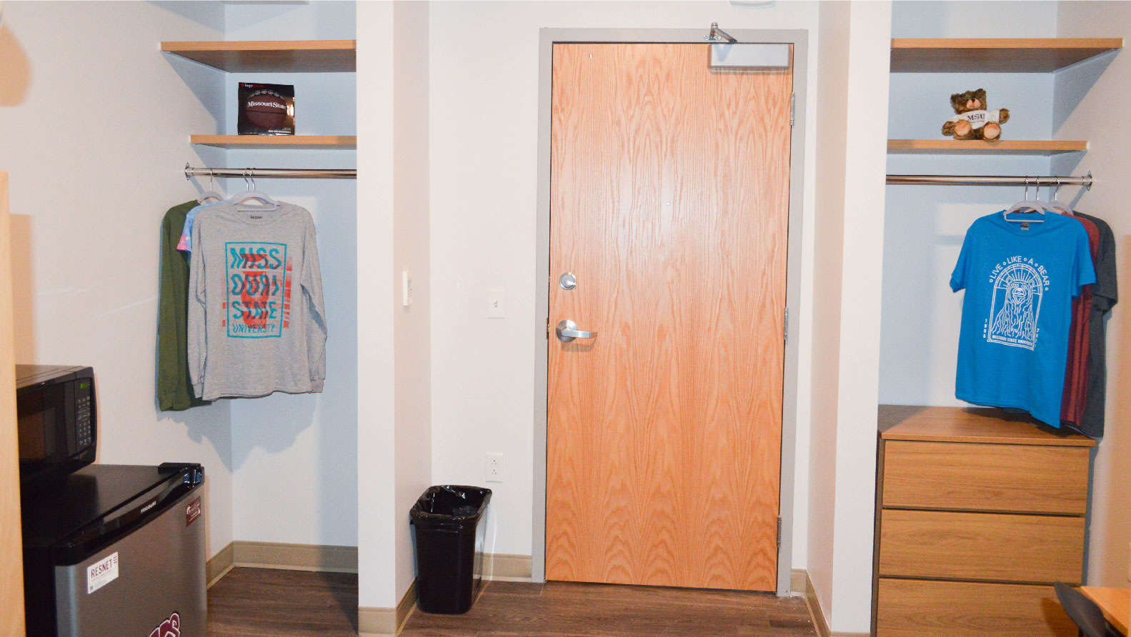 Heitz bedroom closet niche on each side of door with hanging rod and shelf above