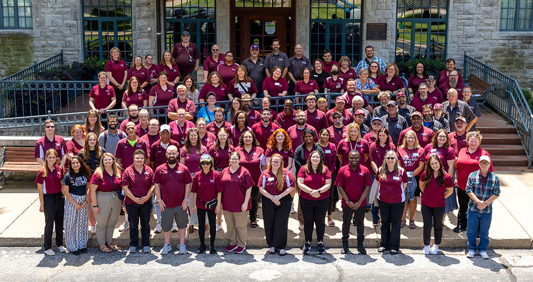 Residence Life Department team standing in front of Kentwood Hall