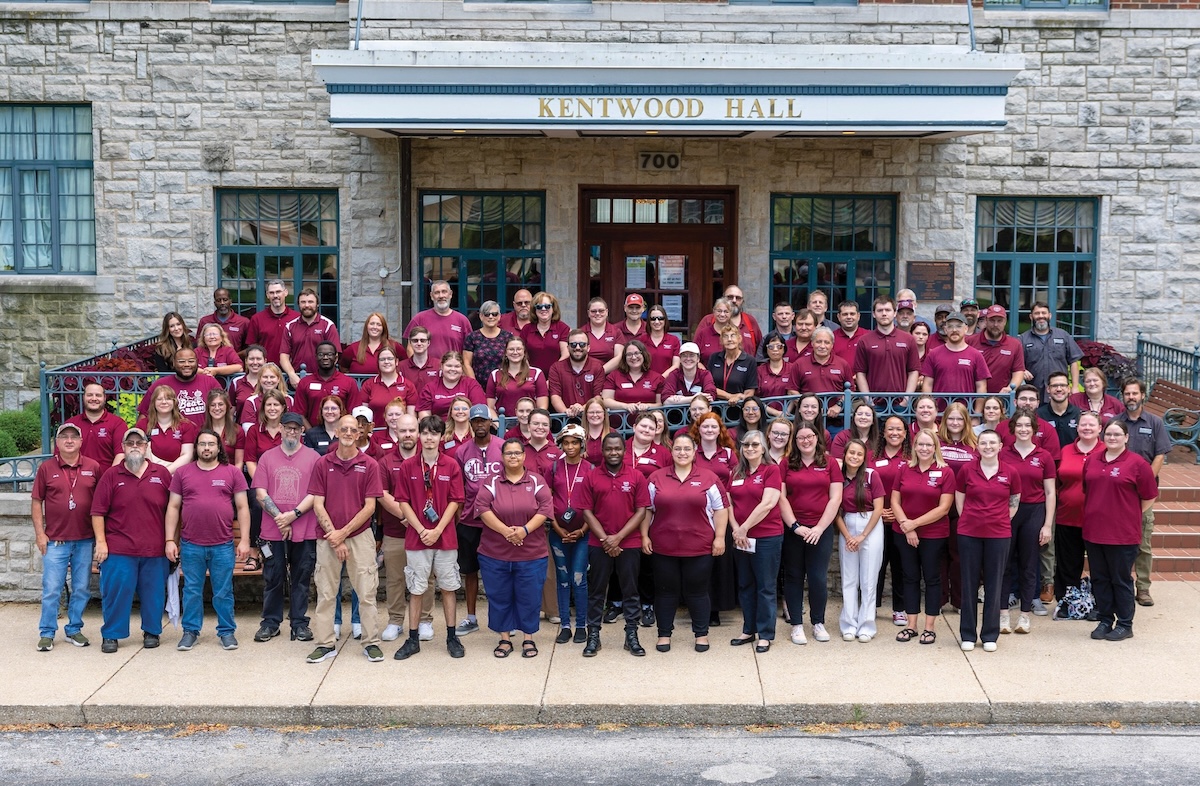 Residence Life Department team standing in front of Kentwood Hall