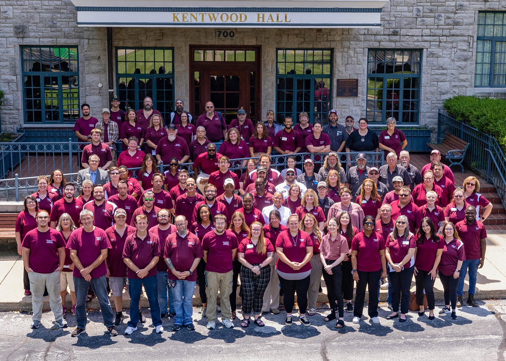 Residence Life Department team standing in front of Kentwood Hall