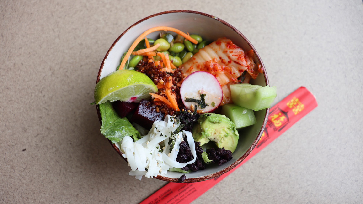 bowl of food with chopsticks