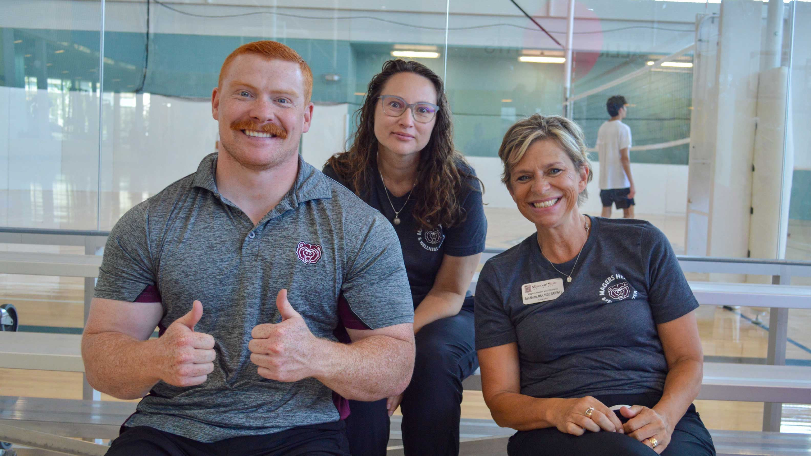 3 people smiling at camera