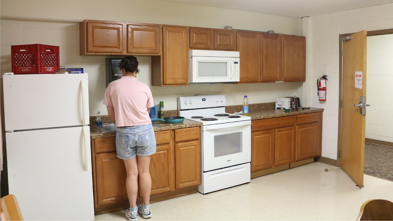 kitchen with fridge stove oven microwave and sink