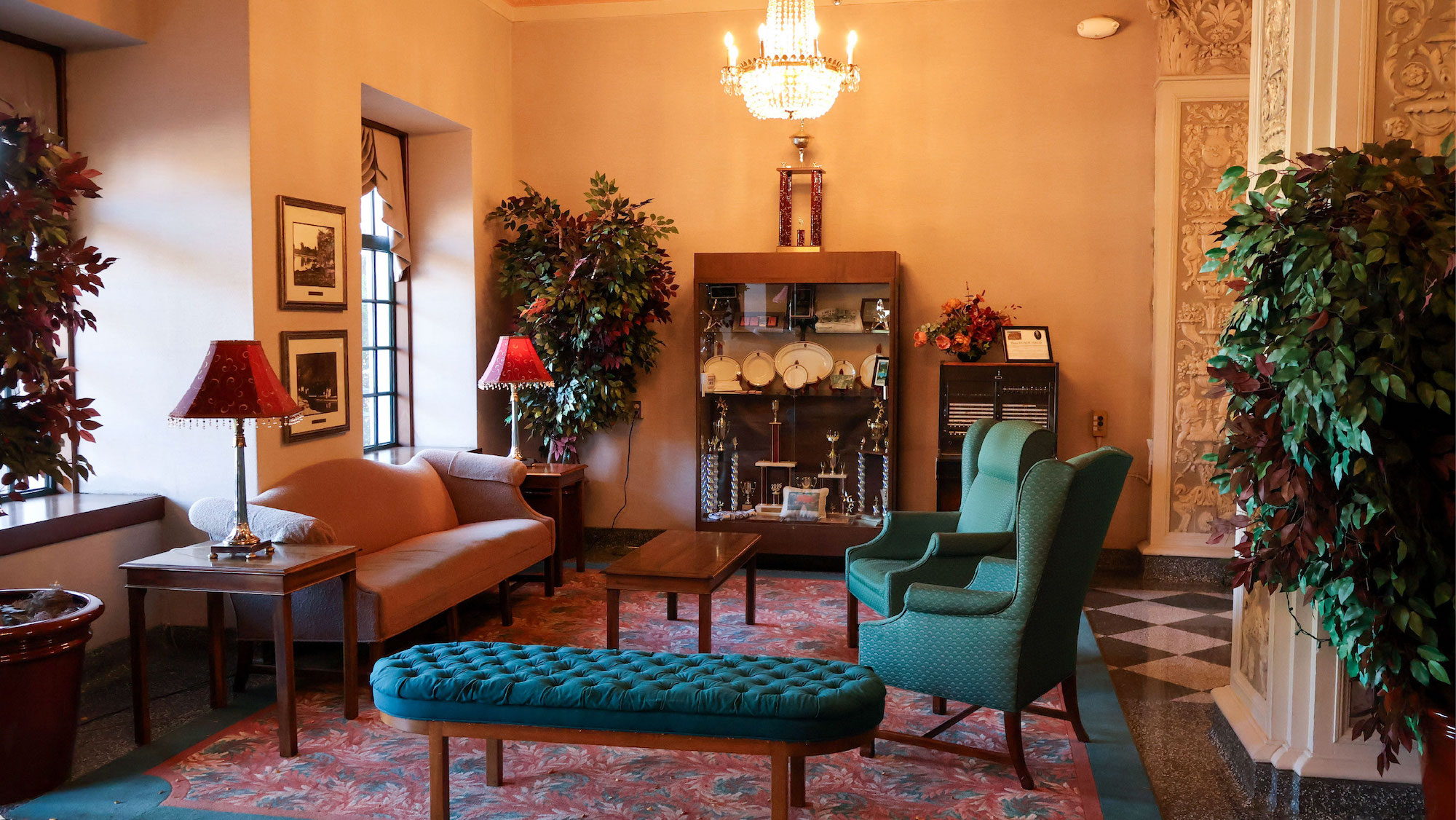 Lounge with sofas armchairs and crystal chandelier