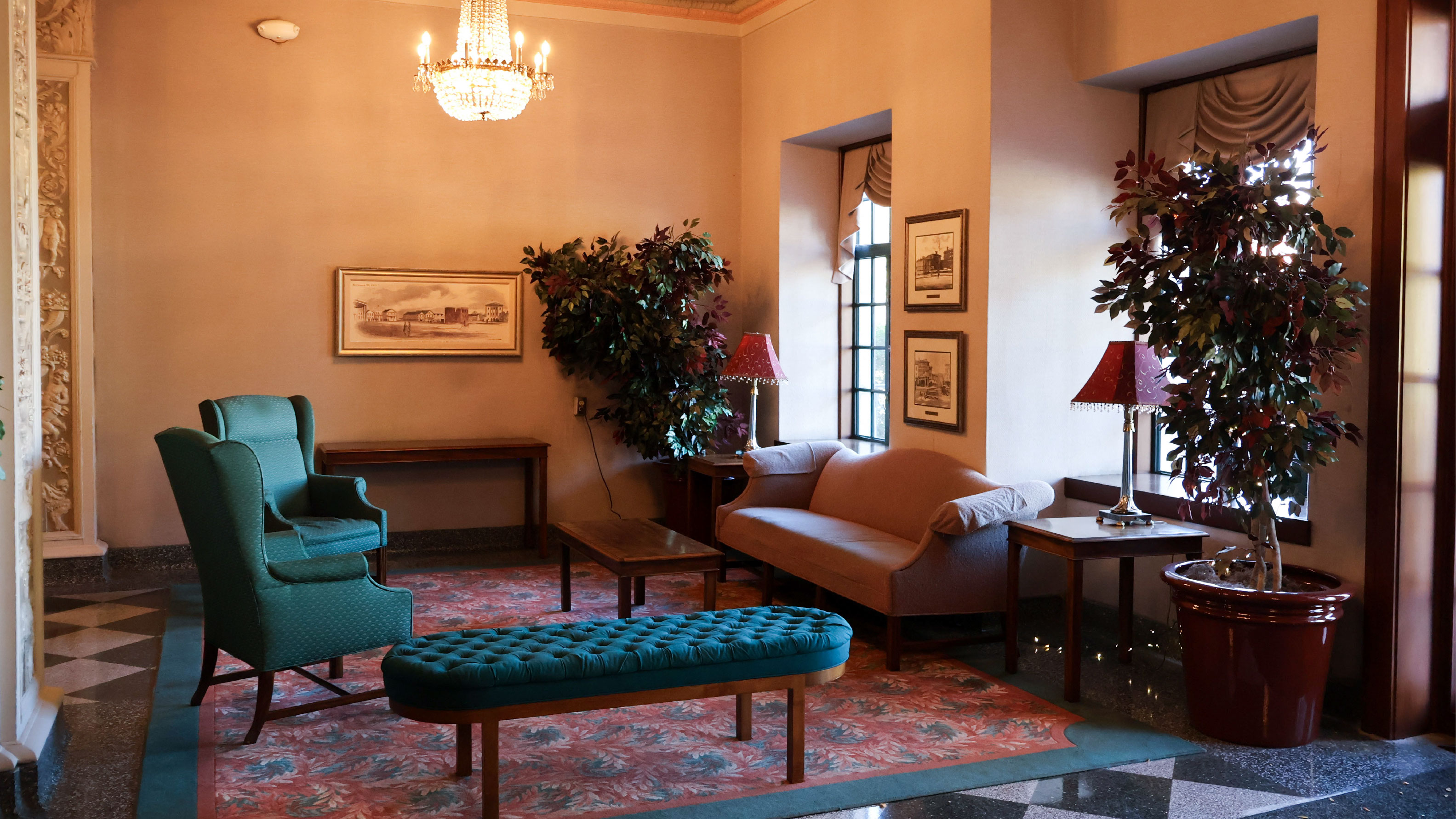 Lounge with sofas armchairs and crystal chandelier