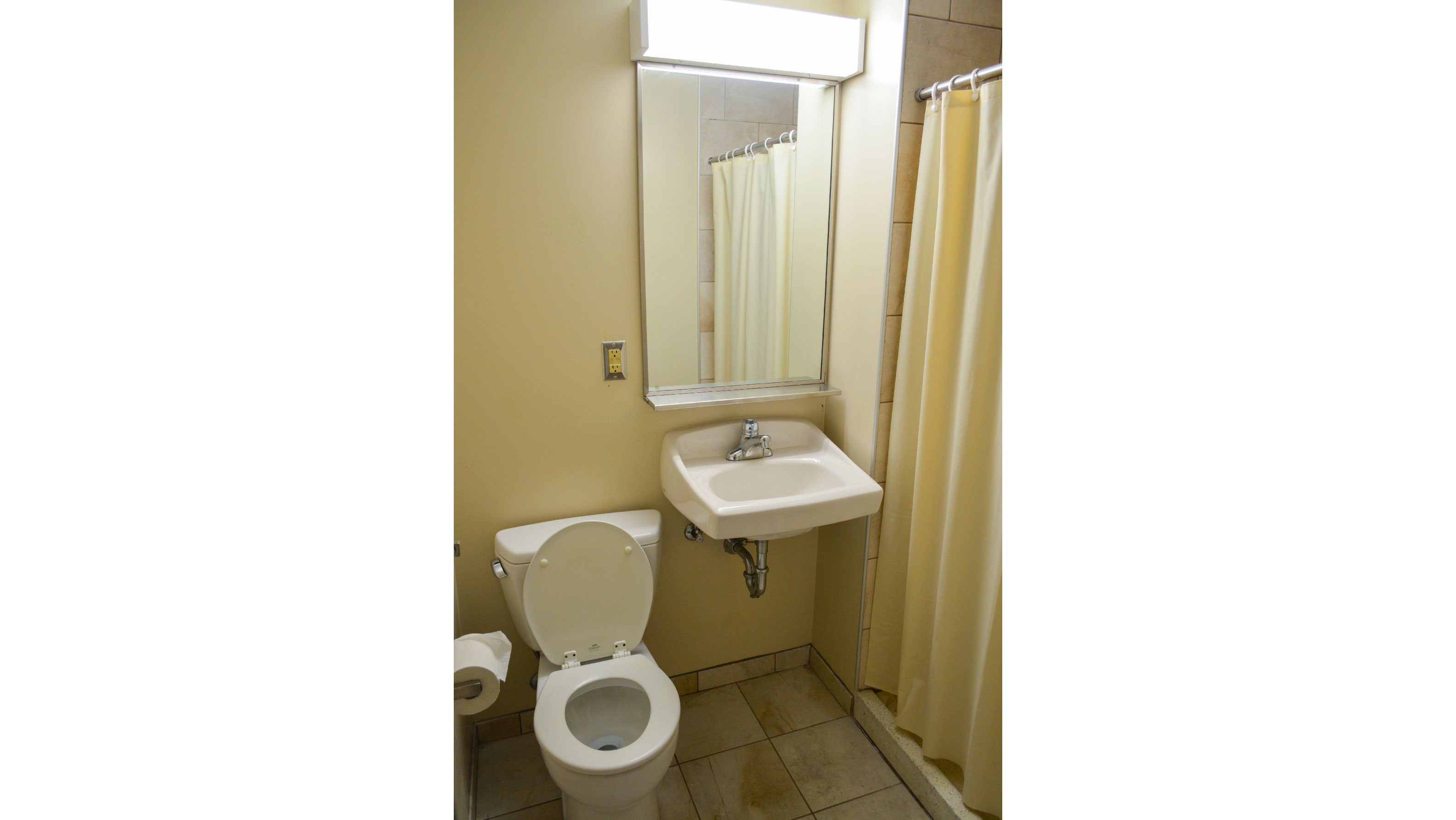 bathroom with toilet sink and shower